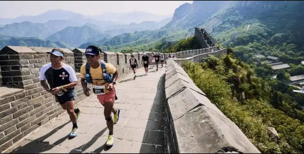 Runners climbing the Great Wall of China during the Great Wall Marathon